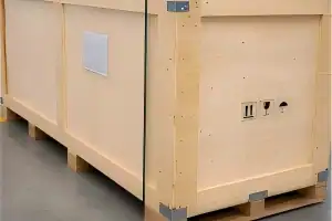 Closed wooden shipping crate raised on timber feet with openings beneath the base.